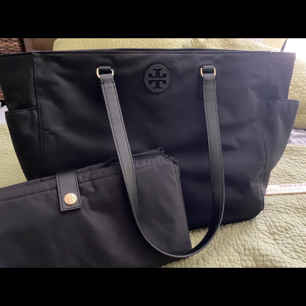 Tory Burch black nylon baby bag with changing pad.